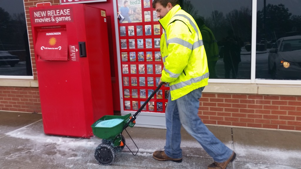 Neil Gilbert salting the sidealk at Walgreens. He's with Whispering Pines Landscaping