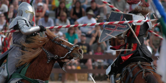 Actor Bill Burch, a.k.a. Sir William, left, shatters his lance on Jarrod Listiak a.k.a. Sir Phillipe a during the jousting performance in the desert arena at the Arizona Rennaissance Festival east of Phoenix. The wildly popular event celebrates the midieval times with a festival, artisans market, live entertainment and 1,000 actors in costume. The event, billed as the "greatest party since Camelot" runs for eight weekends beginning in February. (Rick D'Elia)