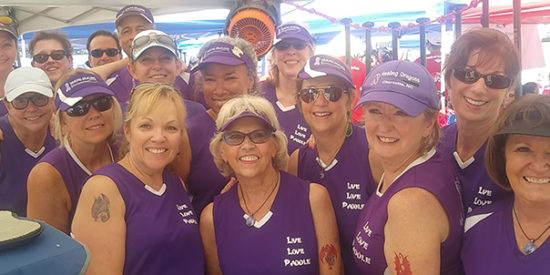 Healing Dragons try to beat cancer one paddle at a time.  Pam Boileaus, the president,  is third from right.