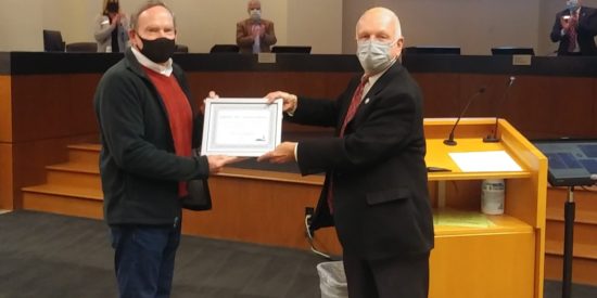 HIGGINS RECEIVES AWARD FROM MAYOR WASHAM