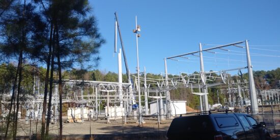 Workers put up 199-foot cell tower 