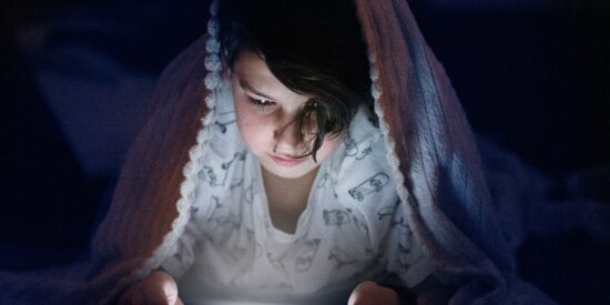 Set limits on electronics during the school week (no more than two hours per day), and require older kids turn in cellphones to you before going to bed. 
