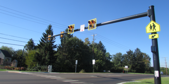 Shown is  an example of a HAWK signal mounted on a single mast arm, similar to the one that will be installed on Westmoreland Road, as well as the location of the new crosswalk. | Town of  Cornelius