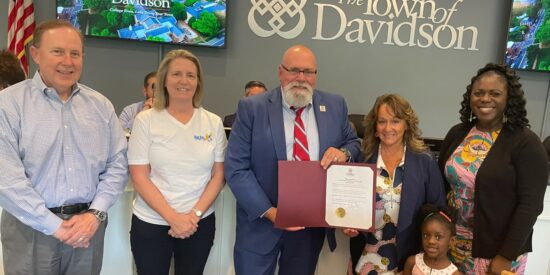 Mayor Rusty Knox, center, proclaimed July 22 Big Day at the Lake. With him are BDATL committee members Eric Dana, Shelley Mahl, Angela Swett and Kalishia Mitchell, with Big Brothers Big Sisters and her daughter