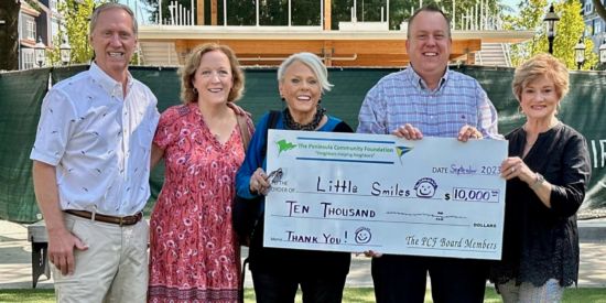 Tom McGinnis and Susan Hartman, PCF board members, Margi Kyle, founder, Tim Boone, president and Sharon Washam, vice president of Little Smiles